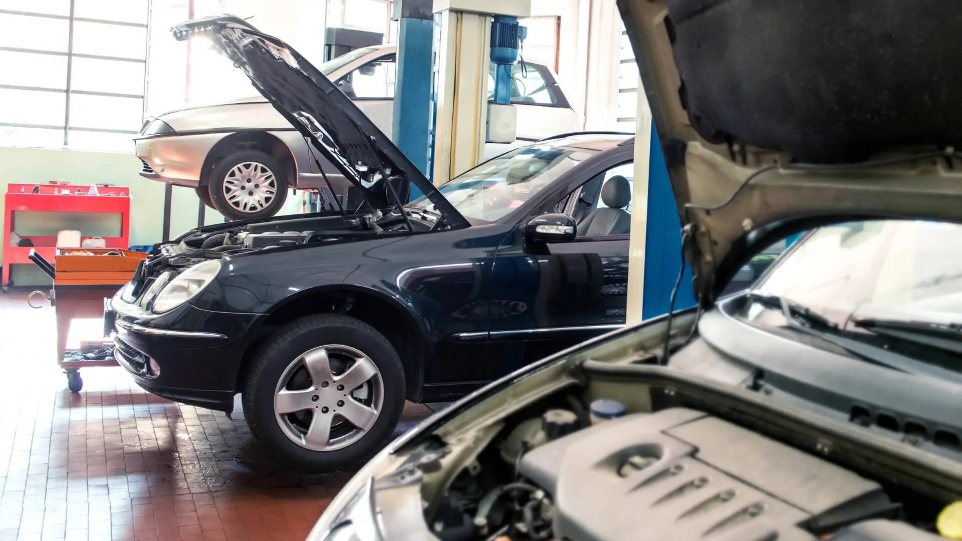 Technician working on a vehicle in a Roadbuck-equipped service bay